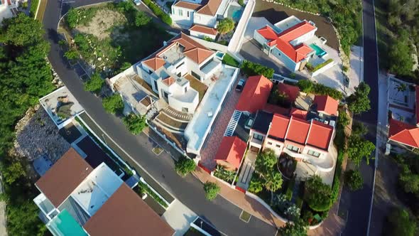 Tilt up aerial view of the luxury homes of the Blue Bay beach in Curacao, Dutch Caribbean island, de