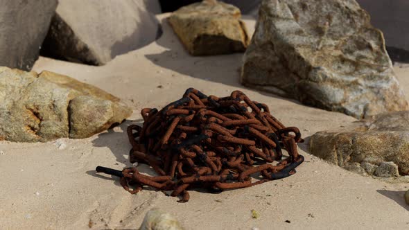 Old Rusted Chain in the Sand