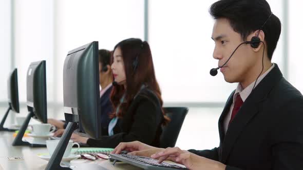 Business People Wearing Headset Working in Office