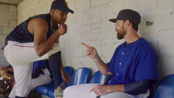 Baseball players discussing together