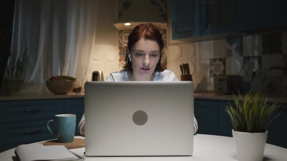 Woman In The Kitchen With Laptop