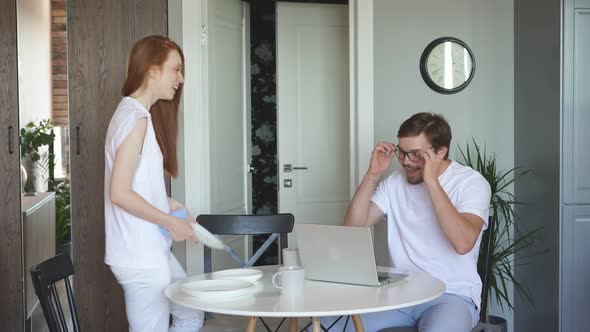 Handsome Guy Work From Home, Smiling Woman Always Near Him