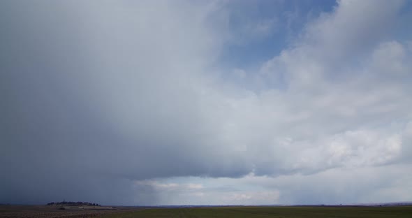 Accumulation Of Snow Clouds Over The Field