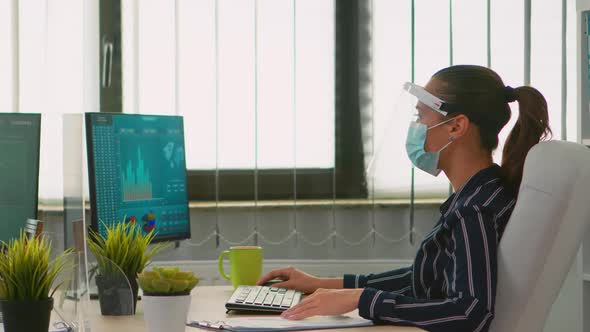 Woman with Face Mask Checking Reports