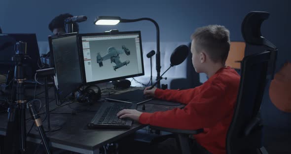 Boy Working on a 3d Model in an Office