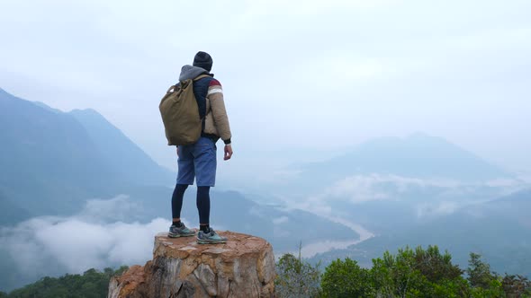 Man On  Top Of Mountain Peak