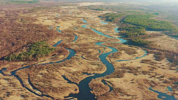 Aerial View Curved River In Early Spring Landscape, River Bends and Dry Grass Landscape