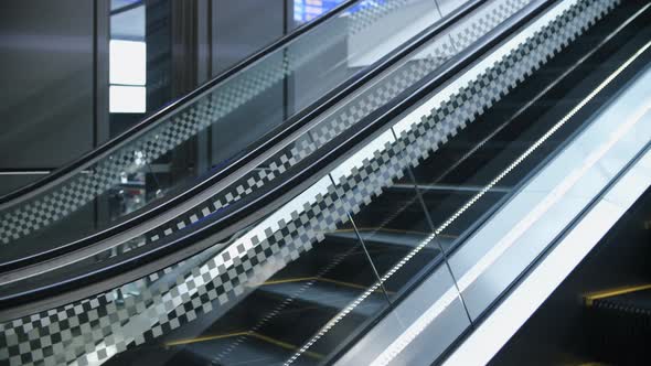 Escalator in airport, train station, subway underground or modern business center