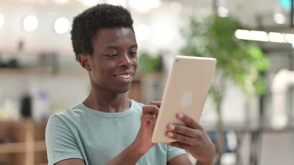 Young African Man Using Tablet
