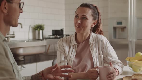 Husband Sharing Pastry with Woman