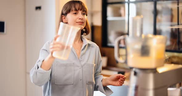 Housewife Prepares Dough for Baking Waffles at Home