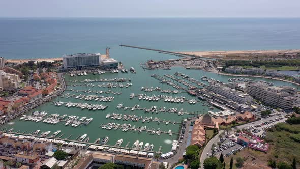 Aerial Video of the Tourist Portuguese Town of Vilamoura with Views of the Beaches and Docks for