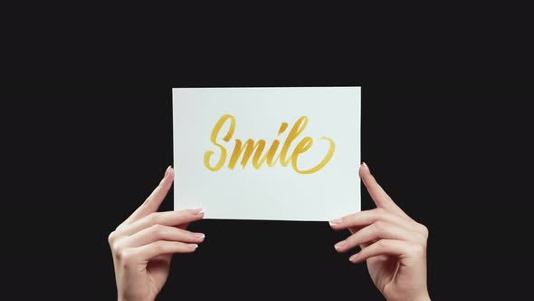 Smile Sign Motivation Card in Hands