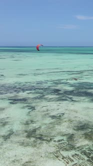 Vertical Video Kitesurfing Near the Shore of Zanzibar Tanzania