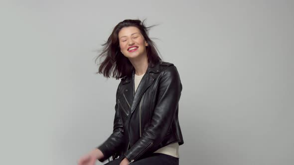 Slow Motion Woman with Blowing Hair in Studio