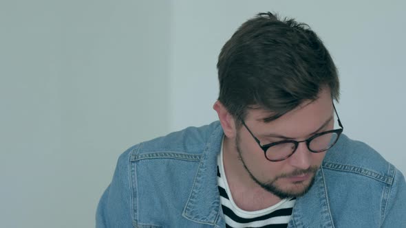 Man works at the laptop in office