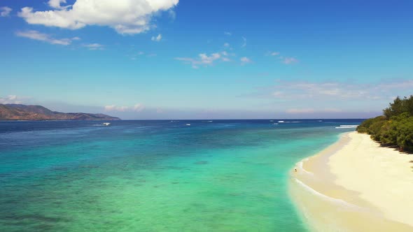 Wide angle overhead abstract view of a white sand paradise beach and blue water background in vibran