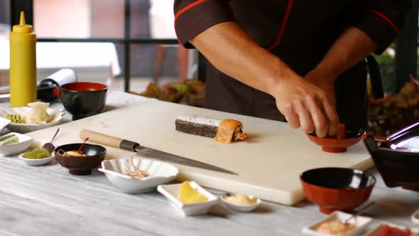 Man's Hands Making Sushi.