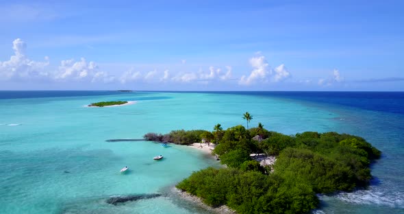 Luxury above island view of a white sandy paradise beach and aqua turquoise water background