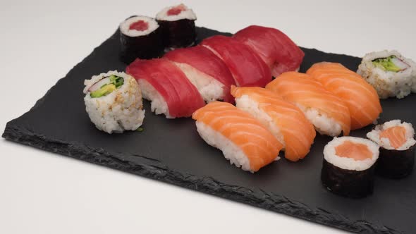 Nigiri sushi salmon, tuna, hosomaki and uramaki. Asian Japanese food gourmet assortment. Traditional