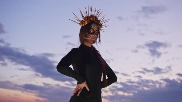 Happy Young Woman in Halloween Costume and Makeup Dances in Nature During Sunset Mystical Footage