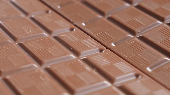 Shiny chocolate bar surface  tasty confection shallow DOF tilting 4K 2160p UltraHD footage - Slow ti