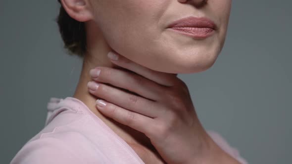 Woman Holding Throat Against Grey Background, Angina Health Problem, Virus