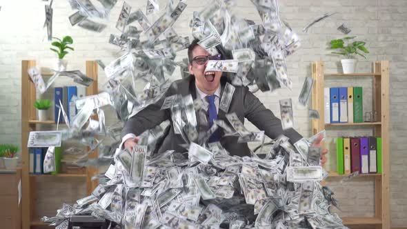 Lucky Man Office Worker in Big Pile of Money on the Table Slow Mo