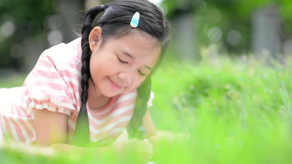 Cute Asian Child Drawing Picture With Crayon