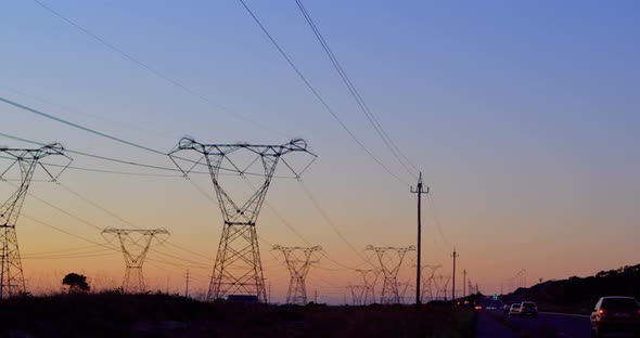 Animation of electricity poles at sunset alt