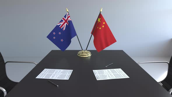 Flags of New Zealand and China and Papers