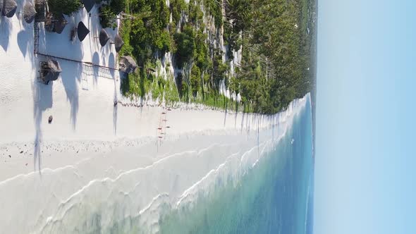 Vertical Video Boats in the Ocean Near the Coast of Zanzibar Tanzania Aerial View