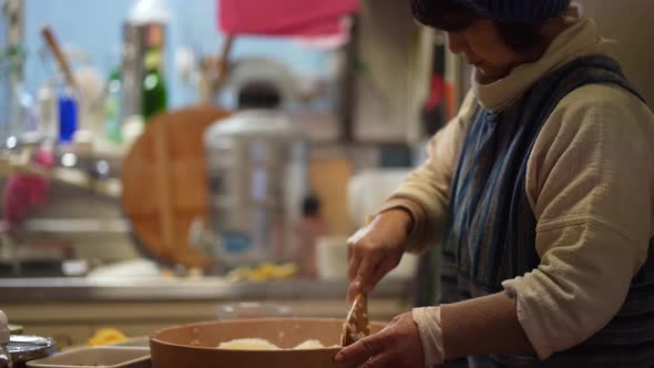 A woman mixing vinegared rice