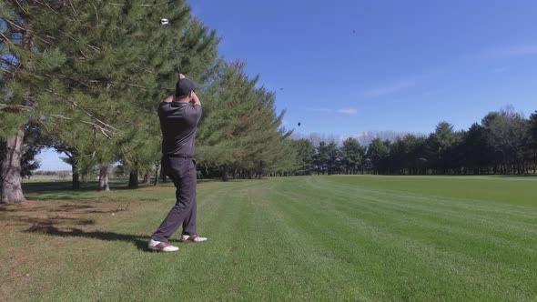 golfer hits the ball down the fairway 4k slider advance