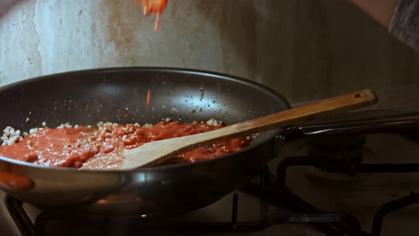 In a Frying Pan with Vegetable Oil Fry Minced Meat Onions and Carrots with Tomato Paste