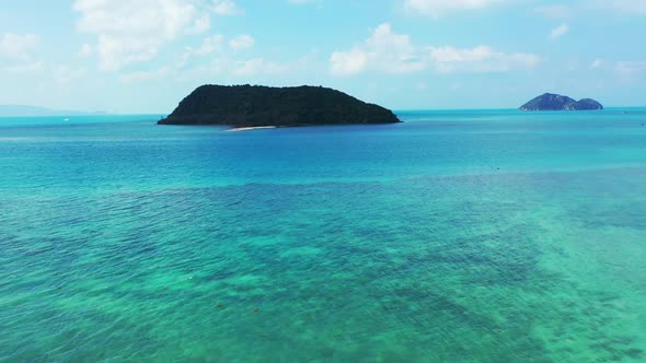 Aerial drone view texture of paradise lagoon beach break by transparent sea with white sand backgrou