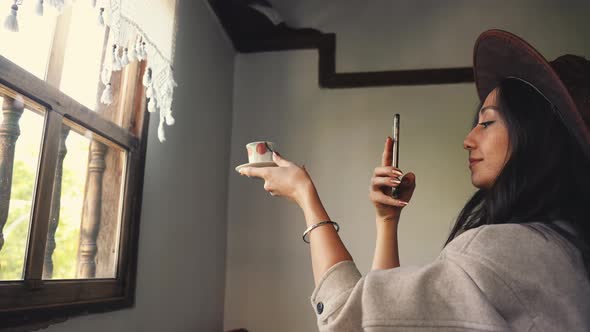 Woman Photographing Cup of Coffee