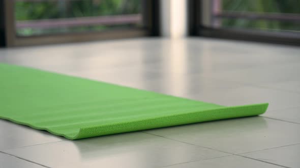 Close-up Shot of Woman Relaxing on a Yoga Mat in a Yoga Studio