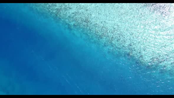 Aerial top down abstract of marine coast beach break by blue water with white sand background of a d