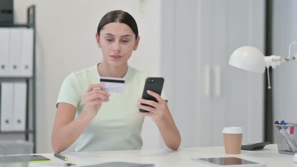 Young Latin Woman Shopping Online on Smartphone