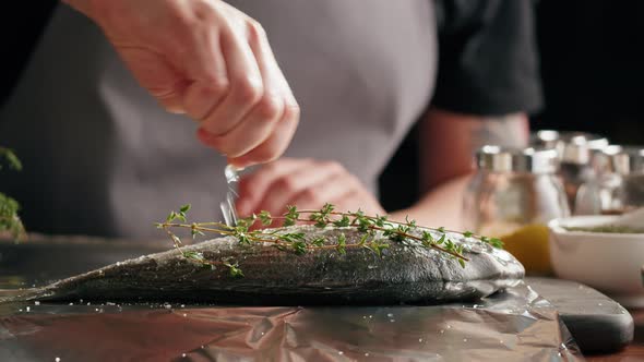 Woman Cooking Fish Closeup