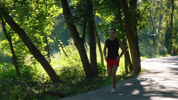 Slow Motion Runner in Sunlit Park