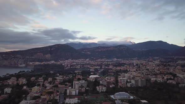 Drone shot of the coastal town of Sorrento in Italy, a beautiful landscape of houses near the bay of