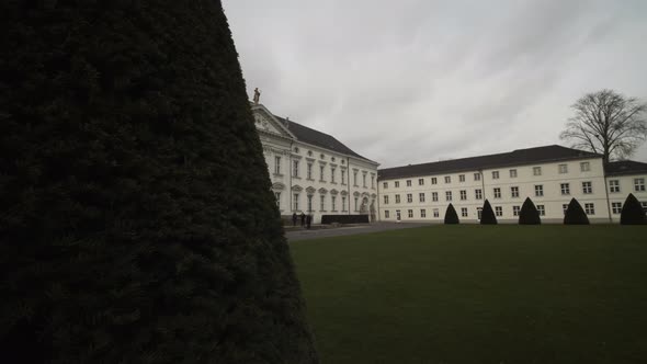 Wide Shot Revealing Bellevue Palace in Berlin, Germany with Green Lawn on Beautiful Day