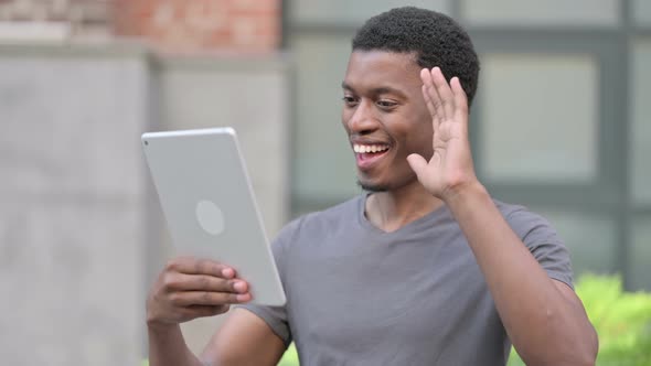 Portrait of Video Call on Tablet By Young African Man 