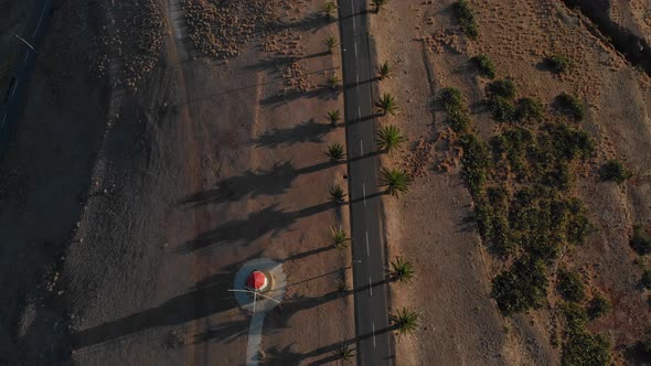 Windmills at Portela Viewpoint in Porto Santo island, Portugal. Aerial forward reveal