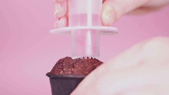 Process of Cutting Out the Core of the Cupcake for Subsequent Filling