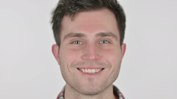 Close Up of Happy Young Man Smiling at Camera