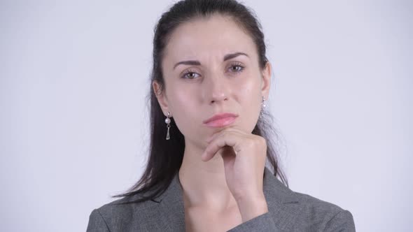 Face of Serious Young Businesswoman Thinking and Looking Down