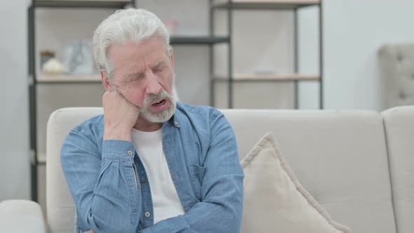 Old Man Taking Nap While Sitting on Sofa